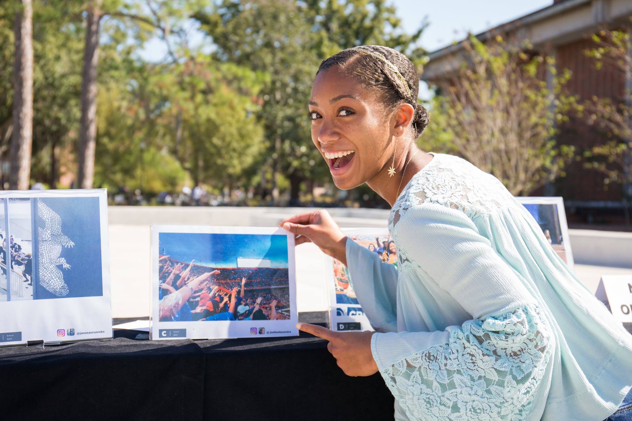 A student discovering her own photograph on display at the Gallery 1853 exhibition for the first time