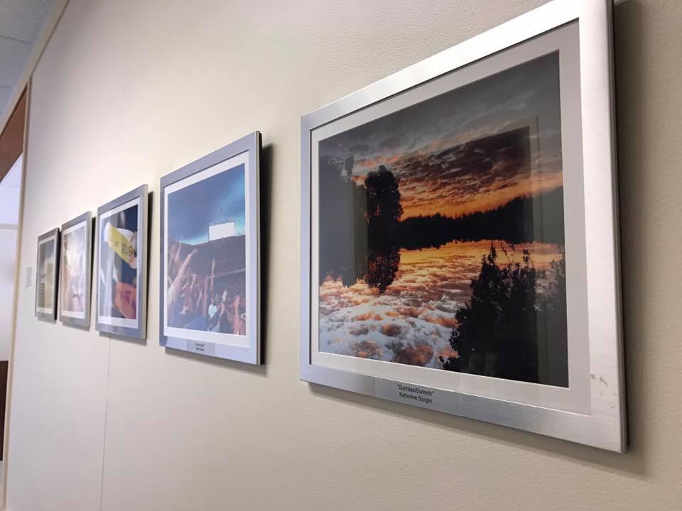 Winning Gallery 1853 photographs permanently mounted on the wall outside the UF President's Office