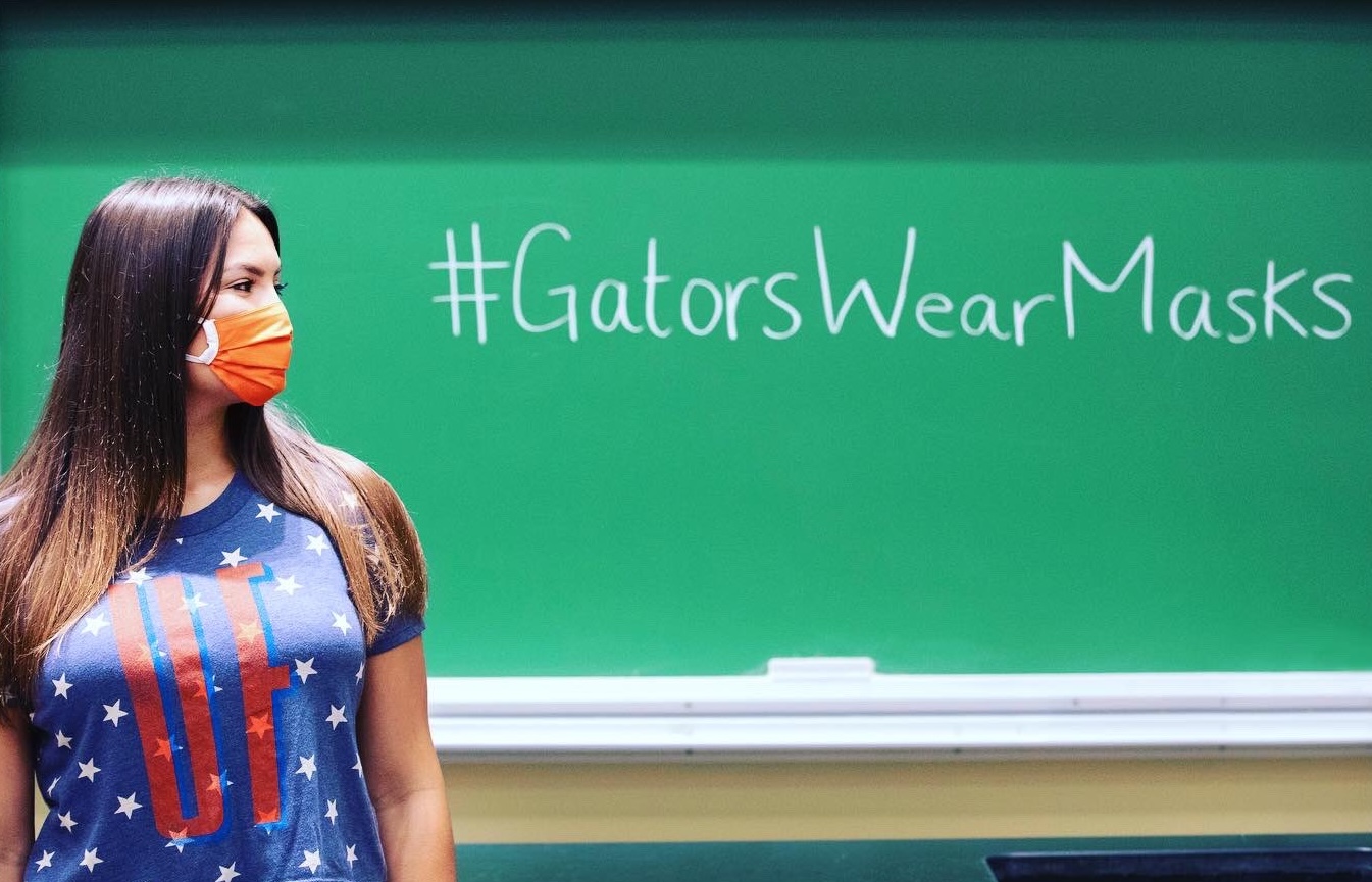 Student wearing a mask on the UF campus
